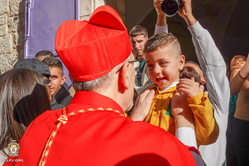 Cardinal Pizzabella and young boy